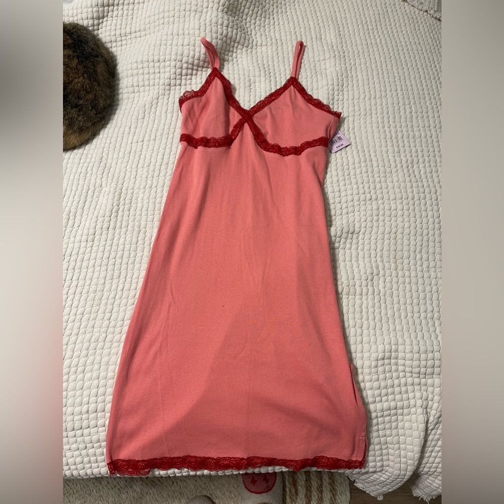 Pink dress with red lace detailing